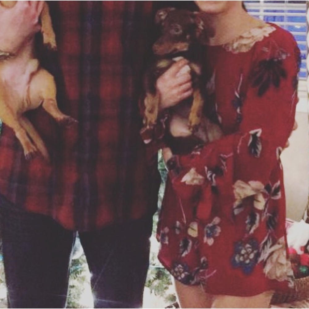 Long sleeve dark red floral romper.